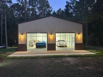 Two-bay steel garage at dusk