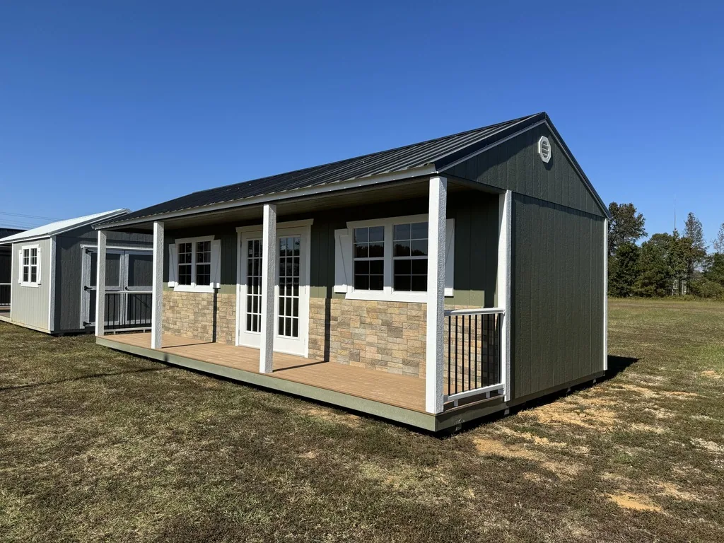 Tiny home with a side porch and stone skirt